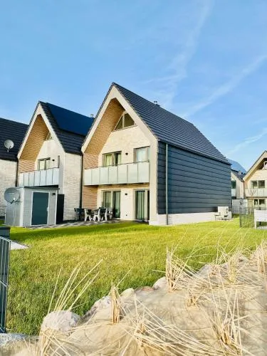 Kleine Freiheit, Büsum - modernes Ferienhaus in direkter Meernähe mit Terrasse, Garten und eigenem Parkplatz in Büsum, Deutschland