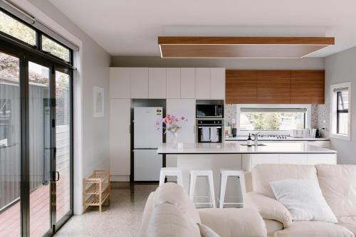 Kitchen, Sunny and Modern Nelson Retreat with Designer Kitchen in Stoke