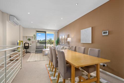 Modern 2BR Stay near Olympic Park with Pool Gym Parking - image 10