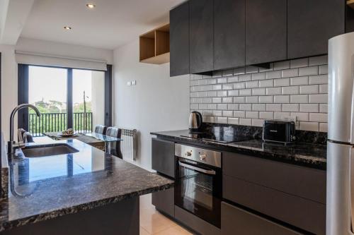 Kitchen, Depto a estrenar frente al mar - 4 personas con cochera privada in Barrio Constitucion