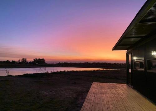 Eco house in a gated neighborhood with a lagoon and dock in San Andres de Giles