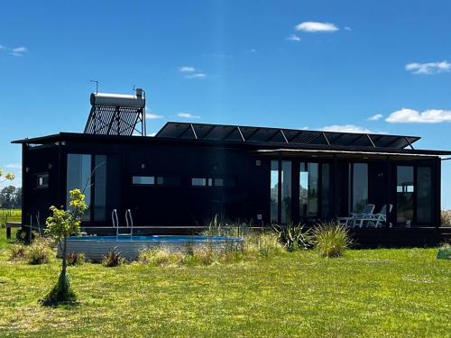 Eco house in a gated neighborhood with a lagoon and dock in San Andres de Giles