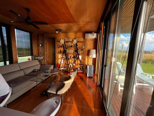 Eco house in a gated neighborhood with a lagoon and dock in San Andres de Giles