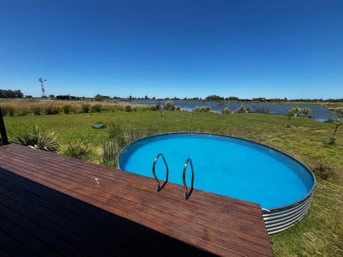 Eco house in a gated neighborhood with a lagoon and dock in San Andres de Giles