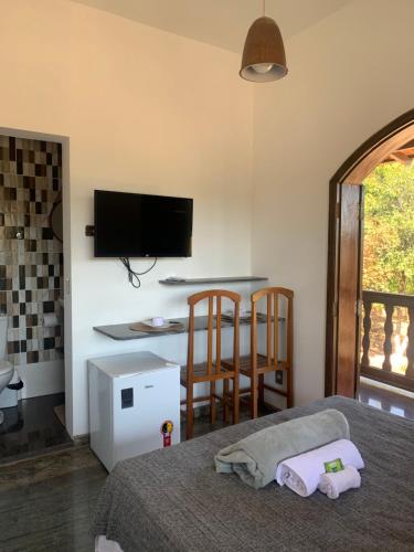 Pousada Flat Royal Suíte com varanda e rede – khách sạn tại Oliveira