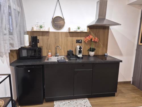 廚房, Cosy Corner - Appartement spa - Jacuzzi in 瑪律薩奈拉科特
