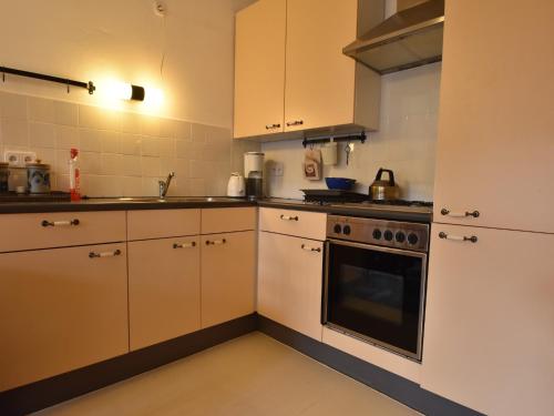 virtuve, Holiday home in a quiet, authentic mountain village with a view of the surrounding hills in Zlata Olesnice