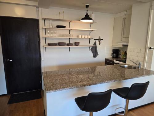 Stylish two-room apartment with balcony & great views in Töölö