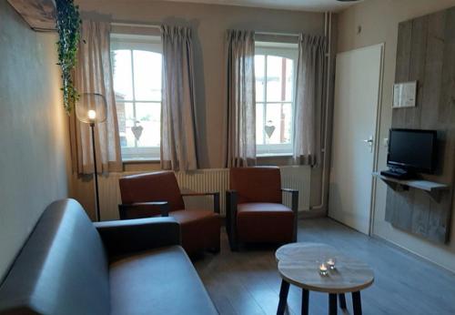 sala de TV, Vakantieboerderij Tergracht - t Huuske in Epen