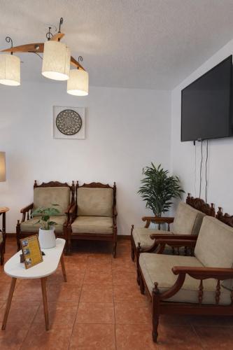 Közös társalgó / TV, Casa completa en Cuenca para 12 personas WiFi Parqueadero BBQ in Ricaurte