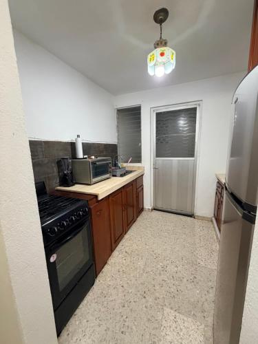 Kitchen, Comodo departamento en planta baja con dos recamaras in Primero de Mayo