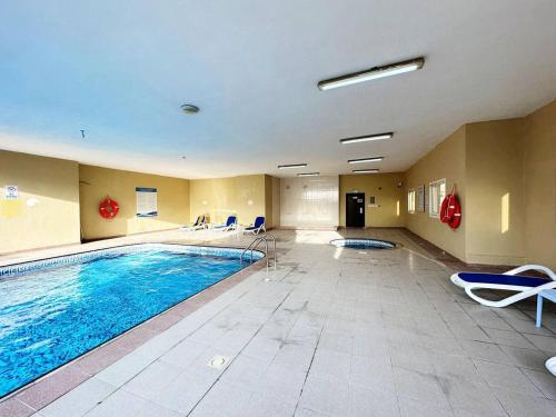 Swimming pool, Cordoba Palace Studio In Silicon Oasis by Petals Holiday Homes in Dubai Silicon Oasis