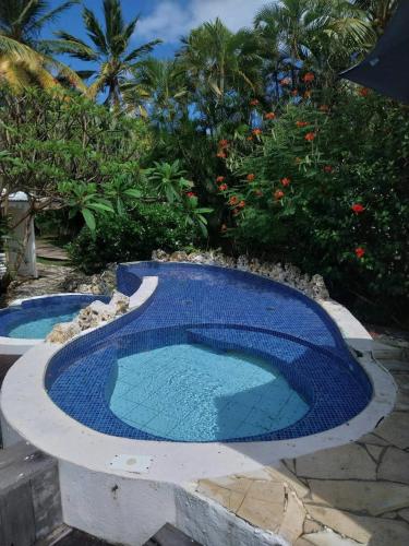 Bungalow moderne avec jardin privé à Grand Bourg (Bungalow moderne avec jardin prive a Grand Bourg) in แกรนด์-บูร์ก