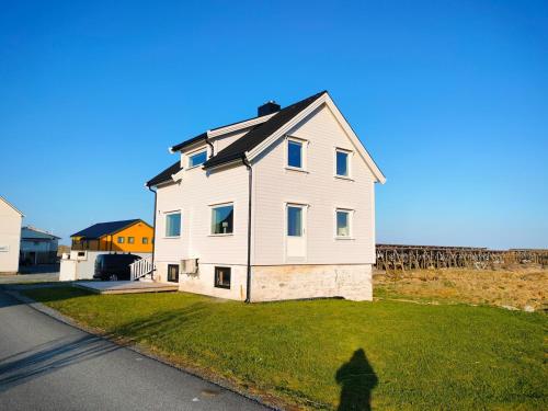 House on beautiful Værøy, mountains and sea outside the window in Kvalnes