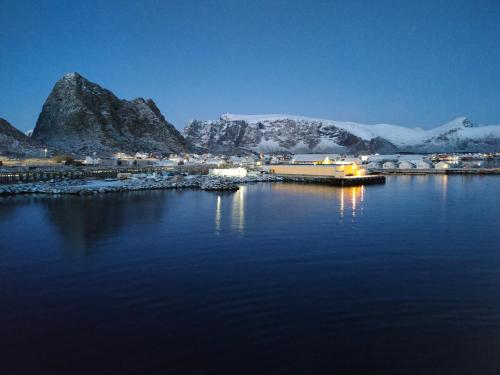 House on beautiful Værøy, mountains and sea outside the window in Kvalnes