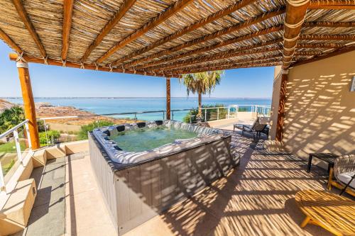 Luxury Oceanfront Villa 7 at Puerta Cortes Resort with Beach Club, Jacuzzi & Golf Cart