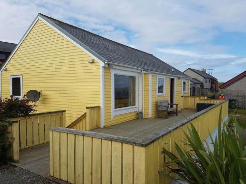 Yellow house on the hill in Brae
