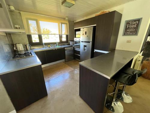 virtuve, Alquiler Casa Exclusivo Country Causana 6 Personas en Villa Carlos Paz in Barrio Cerrado Causana
