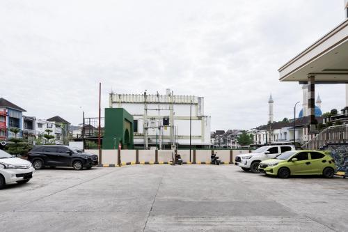 Urbanview Anelia Guest House Syariah Samarinda - Tap to explore photos