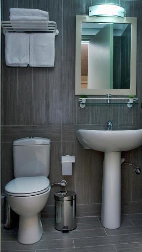 Astron Hotel - Tap to explore photos