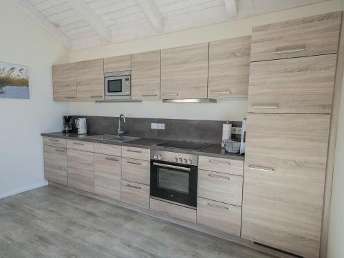 Ferienhaus Theodor Storm 70 mit Garten in 達格比爾