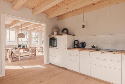 Watermark Usedom - Traumhaus direkt am Wasser mit eigener Badestelle - Haus Woge in Rankwitz, Deutschland