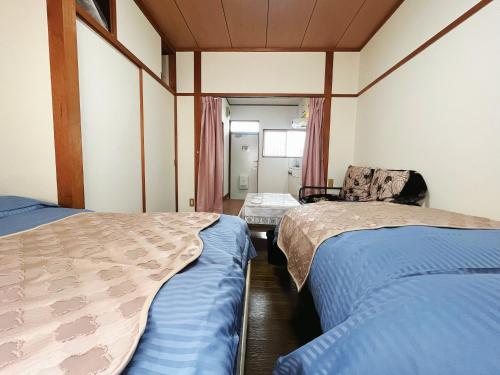 2号房 閑静な住宅街でご宿泊ください 天神博多巨蛋に直行するバスがあります