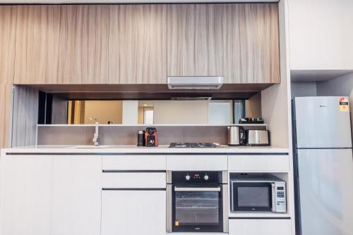 مطبخ, Comfort Apartments Box Hill in بوكس هيل