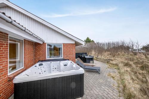 Exterior view, Large, Well-Maintained Holiday Home Near Søndervig, With Activity Room, 6-Person Outdoor Hot Tub And in Ringkobing
