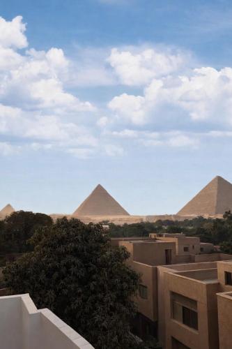 Hathor palace pyramids view - image 4