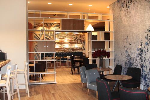 ห้องส่วนกลางสำหรับนั่งเล่น/ดูทีวี, โรงแรมเบสต์ เวสเทิร์น ปิเอมอนเตเซ (Best Western Hotel Piemontese) in แบร์กาโม