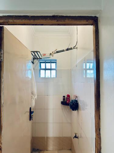Bathroom, Nkare Cottage in Meru