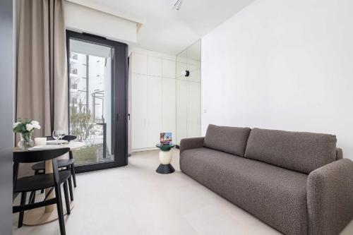 Stylish Apartment with Underground Parking Located Near the TAURON Arena by Noclegi Renters