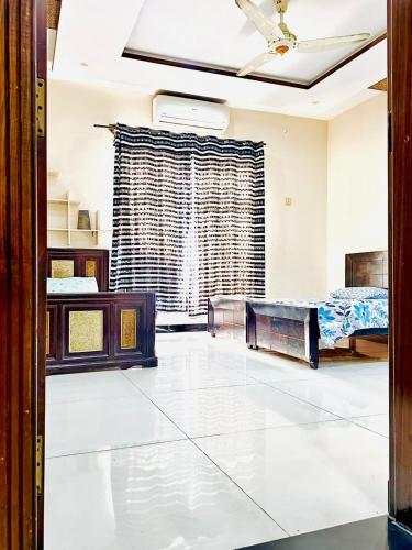 Haven Lodge Lahore by Haven Holiday Homes - 4BR Luxury Guest Suite in a Farmhouse - image 4
