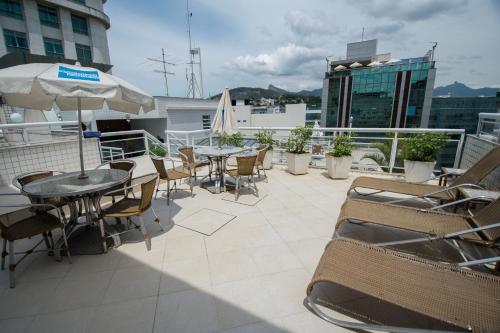 Bar/lounge, Hotel OK near Hobby Sucos E Lanches