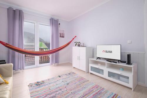 ห้องส่วนกลางสำหรับนั่งเล่น/ดูทีวี, Casa da Praia by Azorean Living in ริเบรา กรานเด