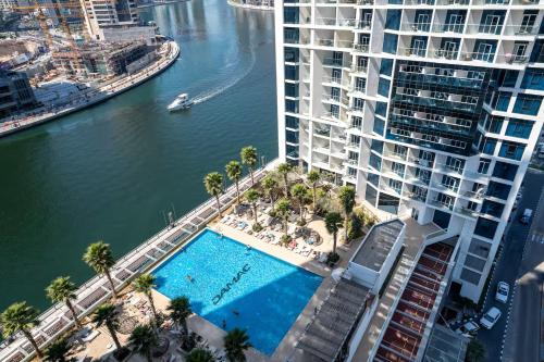 Vogue Vacation Homes, Business Bay Damac Maison Prive near Burj Khalifa and Dubai Mall, Studio Apartment with Balcony, Canal and City View, Access to all Amenities, Dubai