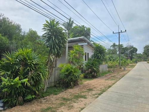 Sukanyawoodhouse near Thai sea