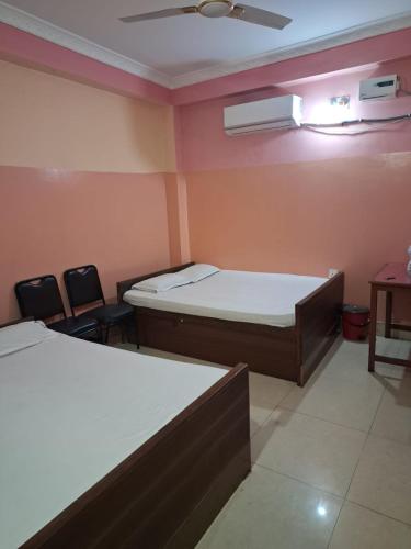 Bed, Raj Mahal guest house and Lodge in Janakpur