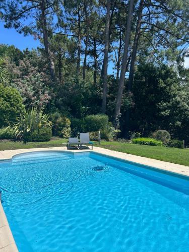 Villa Luxe piscine chauffée, 4 chambres, surplombant le golf entre océan & lac Plage à 5 min