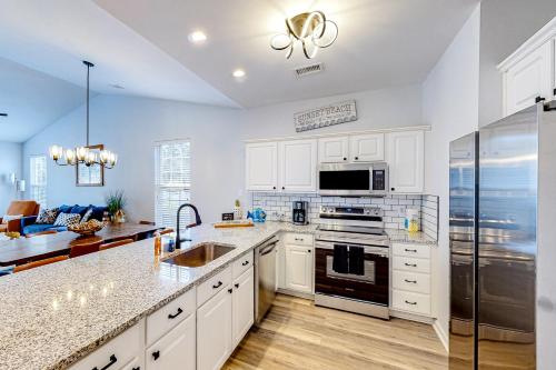 SB40 Family Tides - Sandpiper Bay in Sansetbīča (NC)