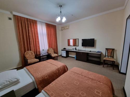 Shared lounge/TV area, GRAND STAR HOTEL in Qarshi