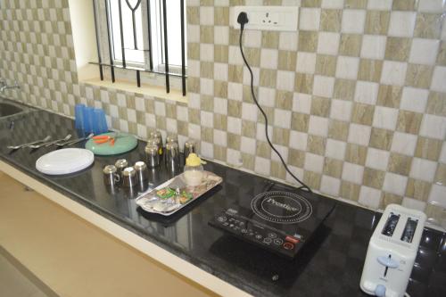 Kitchen, JP Nivaas Guest House in Mayiladuthurai