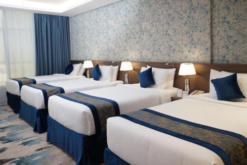 Quad room, deluxe, 4 beds