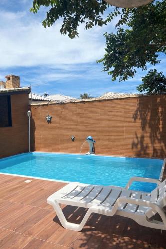 Casa de praia veraneio com piscina e área de jogos – khách sạn tại Unamar