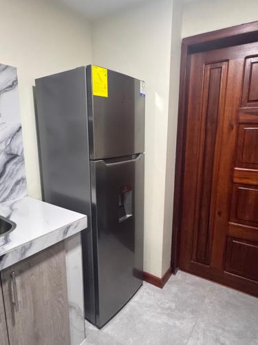 Cocina, Suite ejecutiva con Parqueo Privado in Latacunga