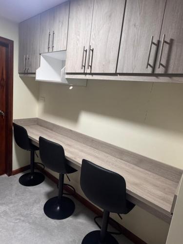 Cocina, Suite ejecutiva con Parqueo Privado in Latacunga