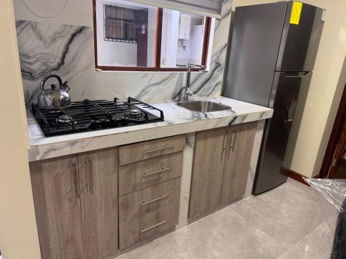 Cocina, Suite ejecutiva con Parqueo Privado in Latacunga