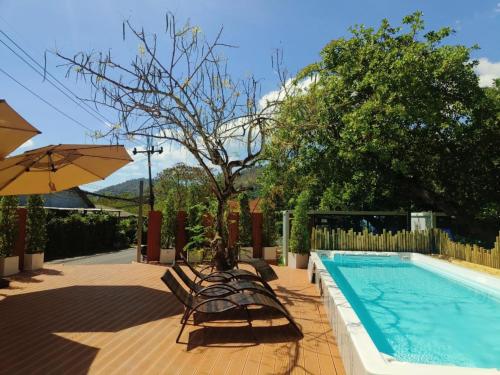 Swimming pool, NeOtel Apartments in Nai Harn Beach