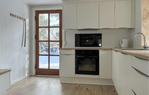 Kitchen, Holiday Home Lejrbjergvej Rømø X in Osterby
